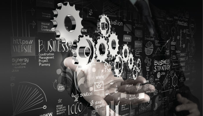 Digital workplace hand and gears image.